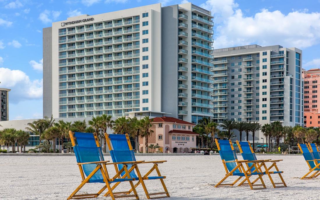 The hotel seen from Clearwater Beach, with sun loungers on the sand