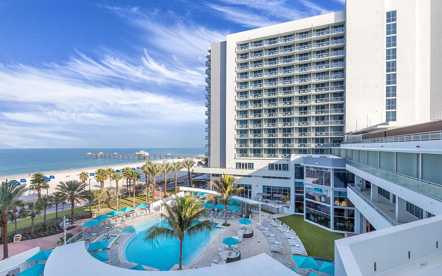 The Wyndham Grand Clearwater Beach seen from above, with its pool deck and the Gulf beyond